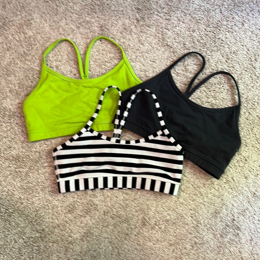 Three lululemon Flow Y bras